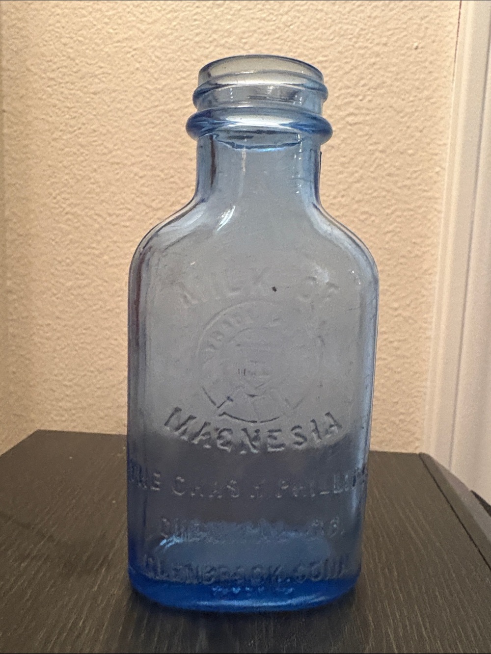 Vintage Blue Glass Milk of Magnetism Bottle